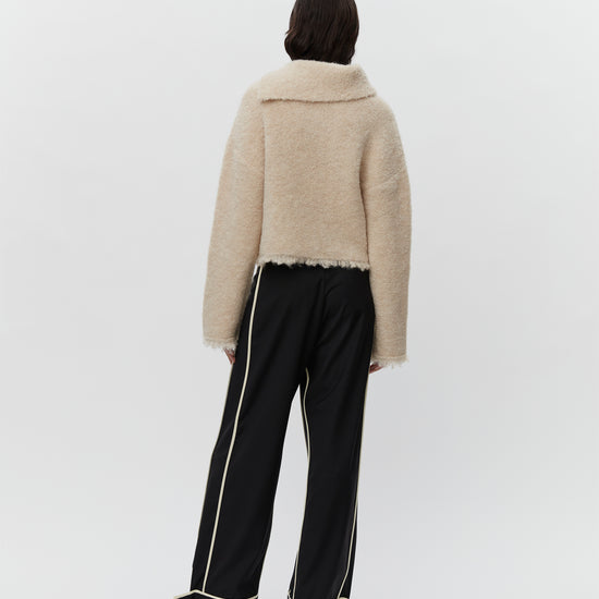 Cream boucle wool jumper with asymetric neckline detail rear view