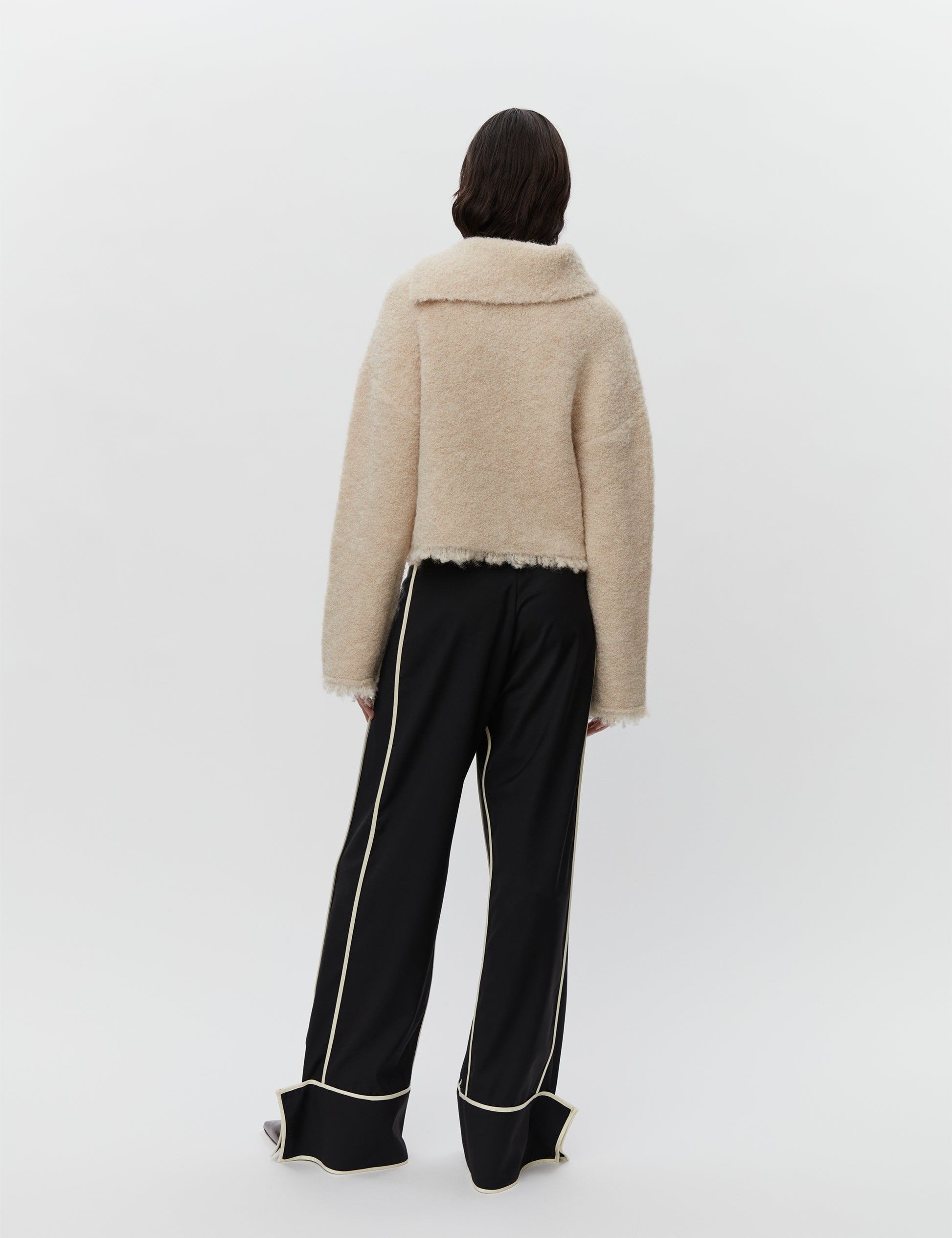 Cream boucle wool jumper with asymetric neckline detail rear view