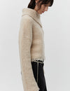 Cream boucle wool jumper with asymetric neckline detail side view