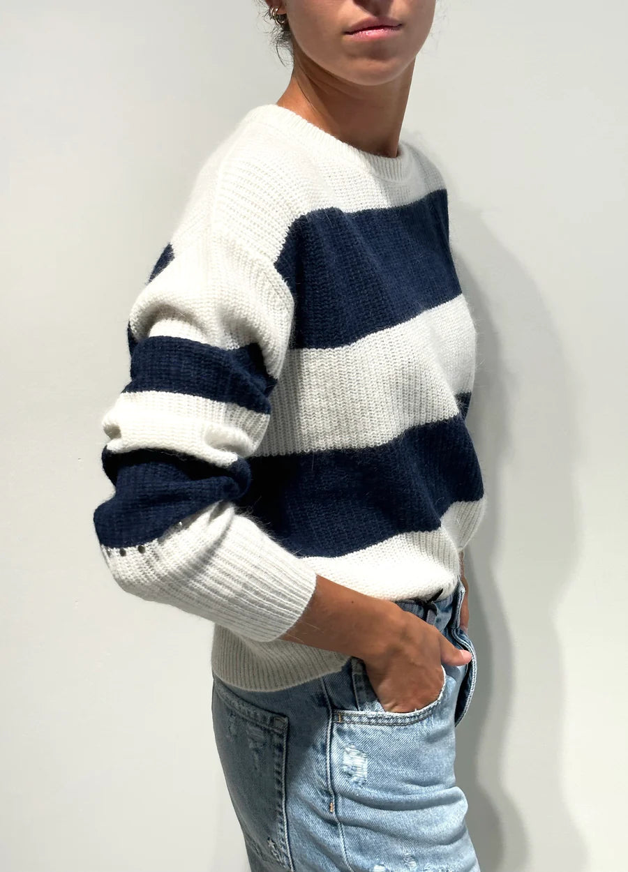 Navy and off white jumper with crew neck and studding detail above hem and cuffs