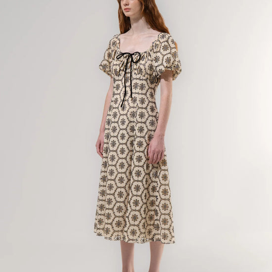 Woman wearing a floral dress on a white background