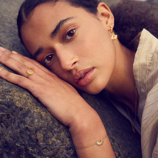 gold bracelet with rising sun in the centre with lobster clasp from rachel jackson  model shot 