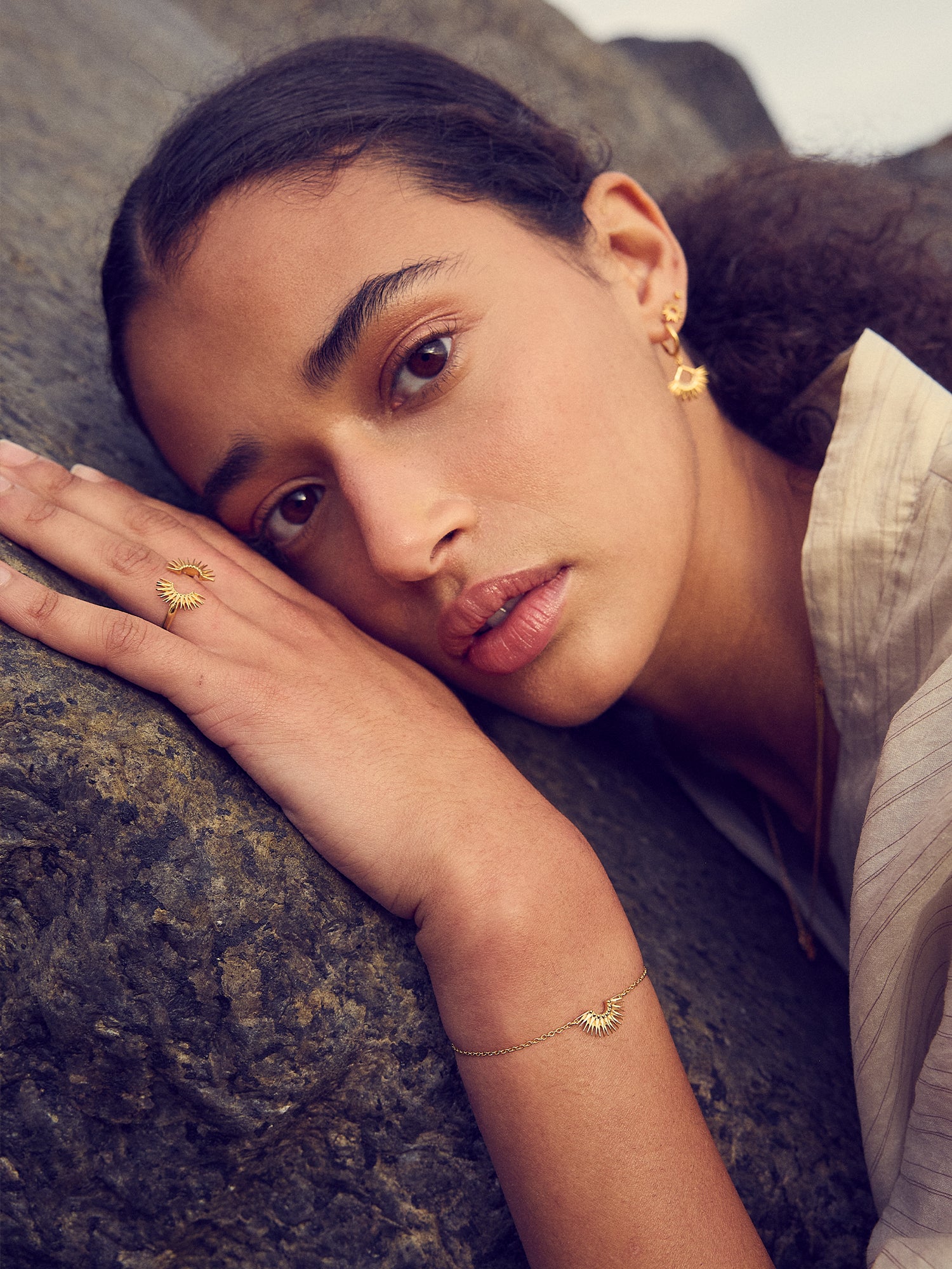 gold bracelet with rising sun in the centre with lobster clasp from rachel jackson  model shot 