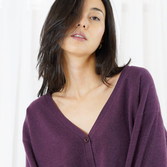 Woman modelling v neck purple cardigan