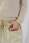 woman wearing beige turtle neck jumper close up