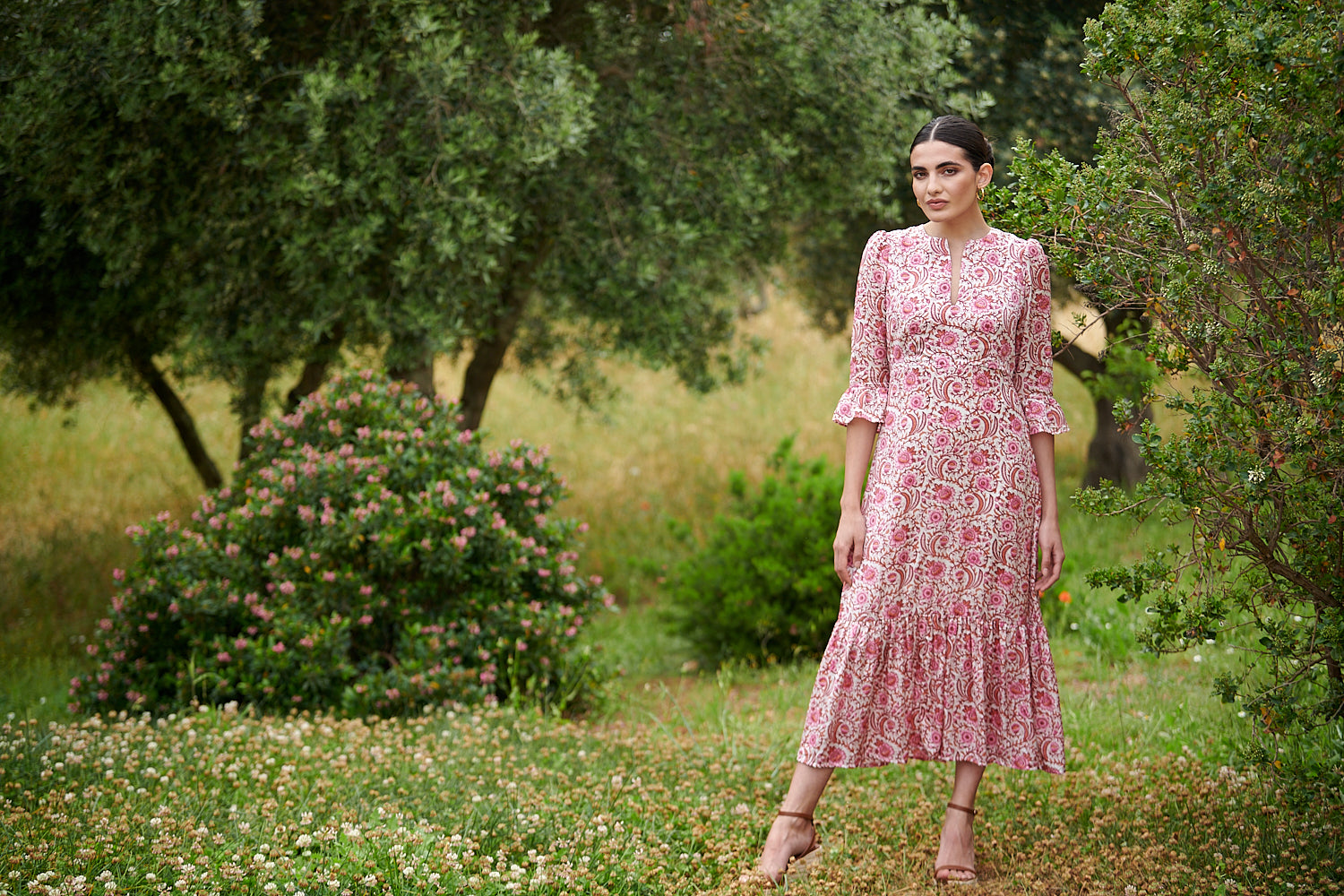 Pink floral midi dress with slash neckline three quarter sleeves with ruffle detail empire line and deep ruffle hem