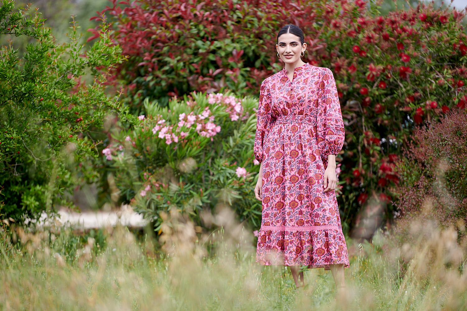 Pink midi dress with floral details with bracelet length sleeves mau collar covered button half placket elasticated waist with drawstring and gathered hem with lace inserts