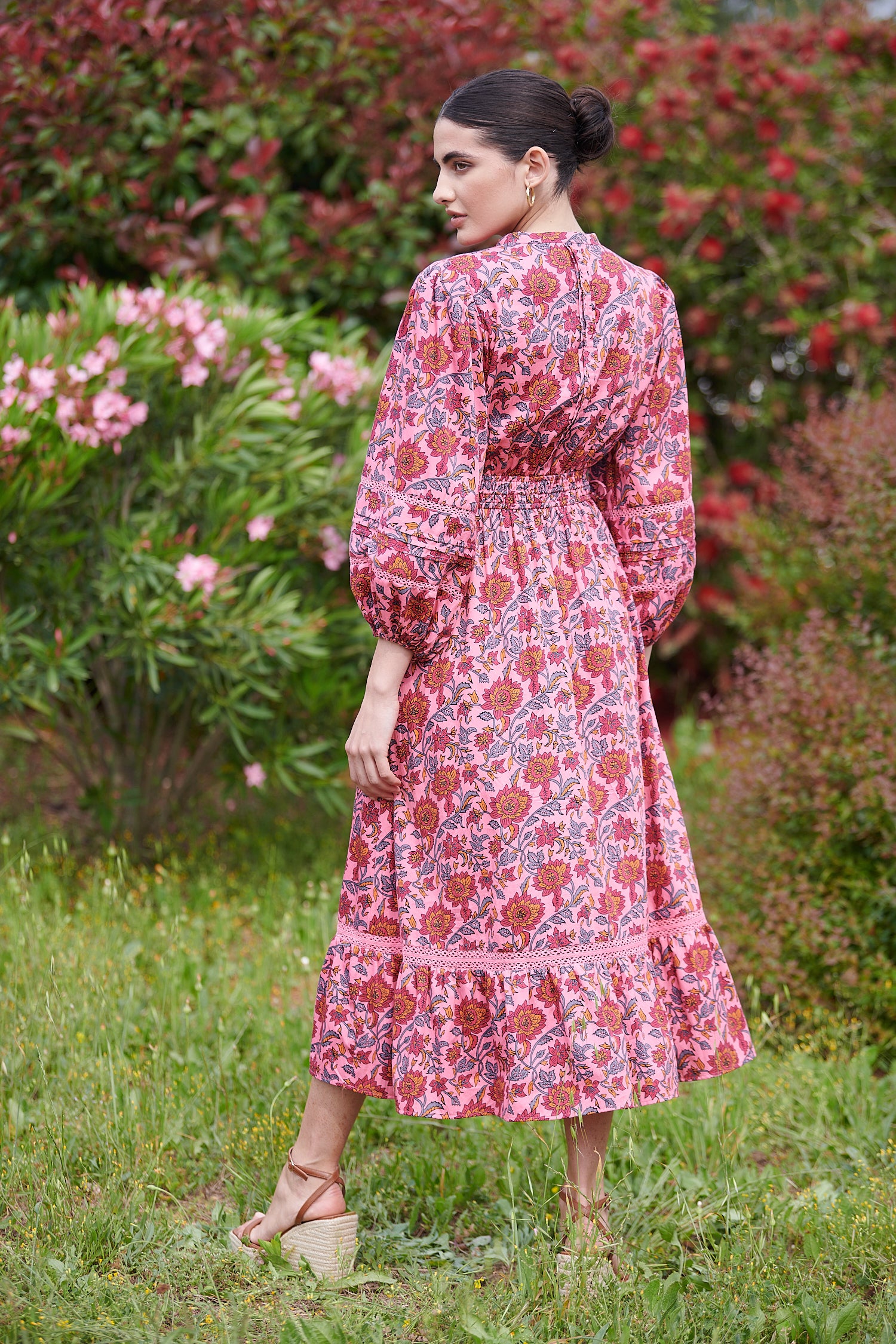 Pink midi dress with floral details with bracelet length sleeves mau collar covered button half placket elasticated waist with drawstring and gathered hem with lace inserts