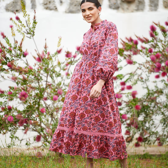 Pink midi dress with floral details with bracelet length sleeves mau collar covered button half placket elasticated waist with drawstring and gathered hem with lace inserts