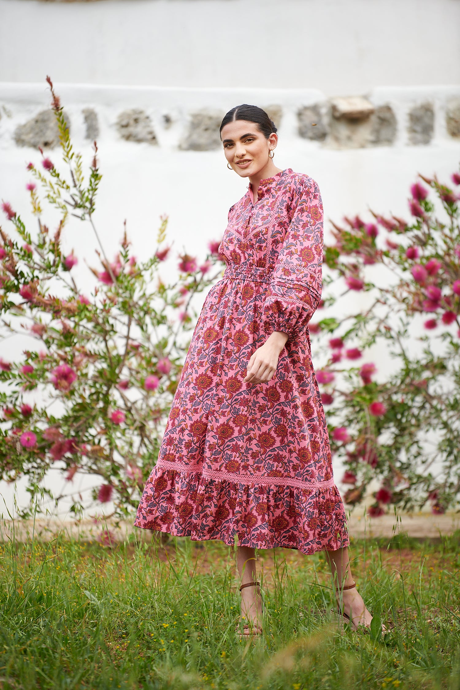 Pink midi dress with floral details with bracelet length sleeves mau collar covered button half placket elasticated waist with drawstring and gathered hem with lace inserts