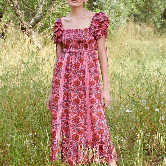 Pink midi dress with all over floral pattern square neckline and puff sleeves with elasticated cuffs and drawstring details 