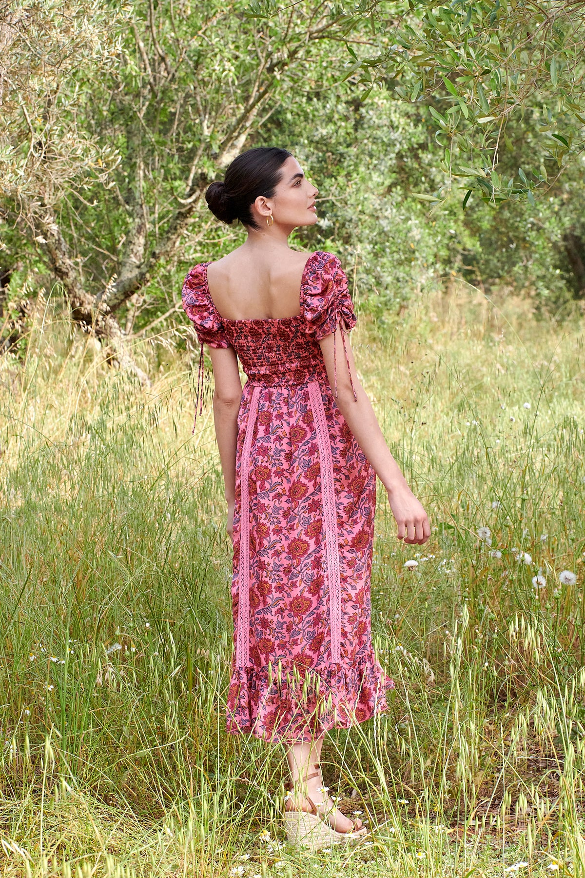 Pink midi dress with all over floral pattern square neckline and puff sleeves with elasticated cuffs and drawstring details