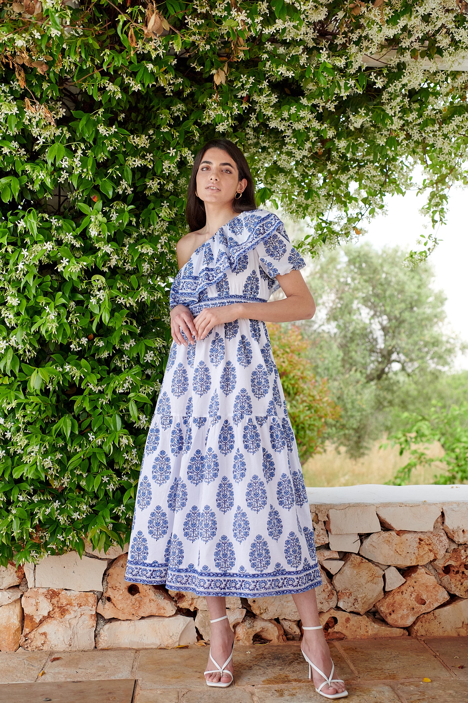 One shoulder midi dress with ruched waistline with white background and blue floral print