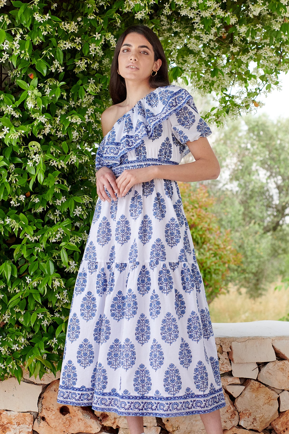 One shoulder midi dress with ruched waistline with white background and blue floral print