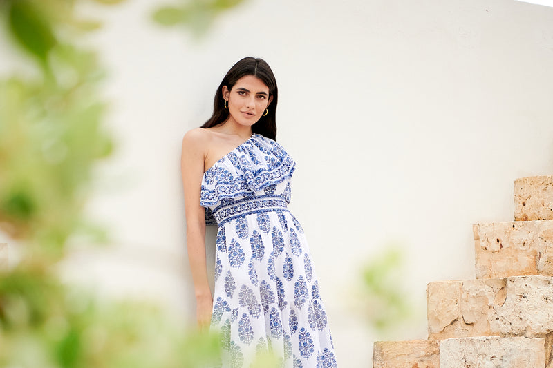 One shoulder midi dress with ruched waistline with white background and blue floral print