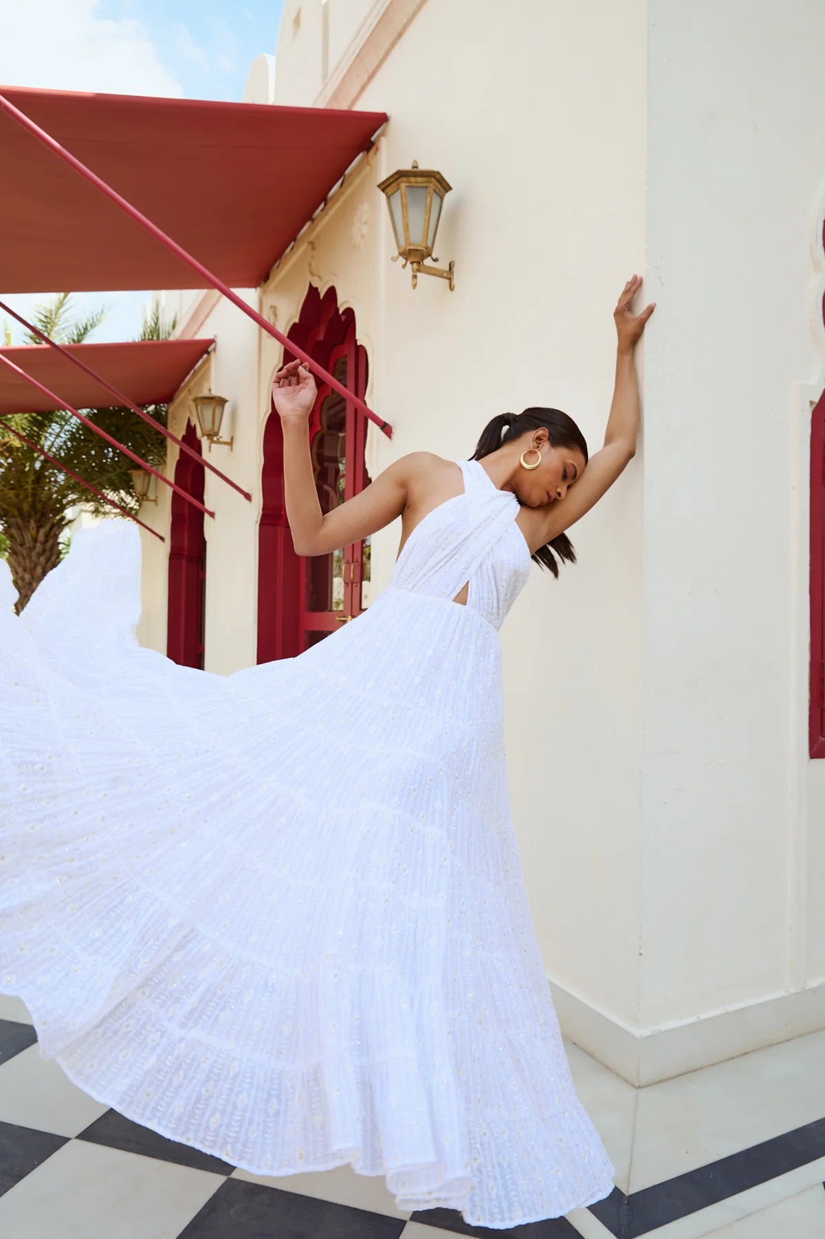 White embroidered cross front and knot back maxi dress with multiple tiers and tiny sequin details