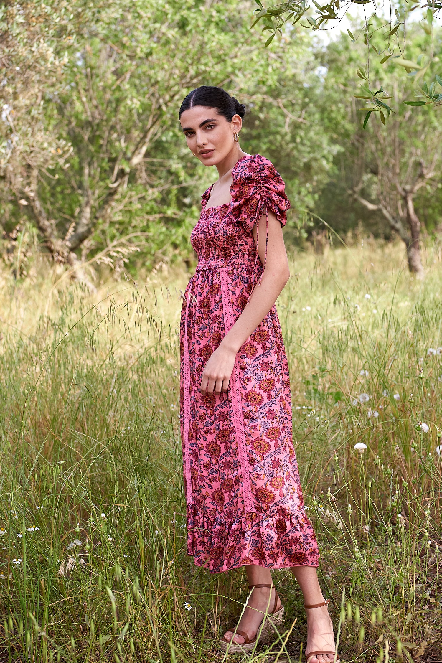 Pink midi dress with all over floral pattern square neckline and puff sleeves with elasticated cuffs and drawstring details