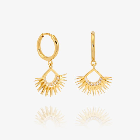 gold rising sun charm huggie earrings with diamante detailing from rachel jackson