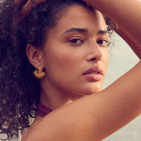 gold circular spike stud earrings from rachel jackson model shot