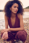 medium sized half sunshine with gold spikes on a delicate gold chain from rachel jackson model shot