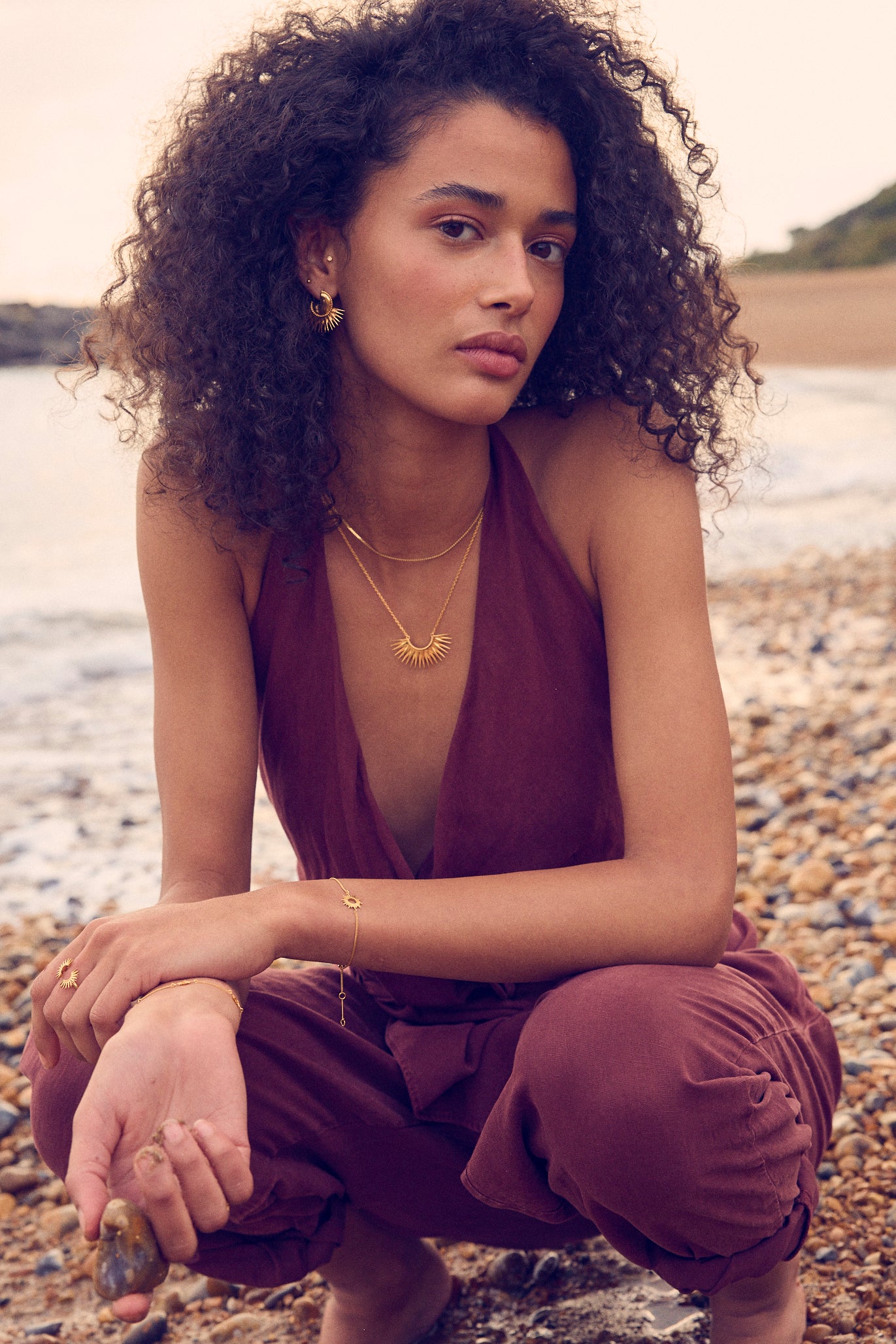 medium sized half sunshine with gold spikes on a delicate gold chain from rachel jackson model shot