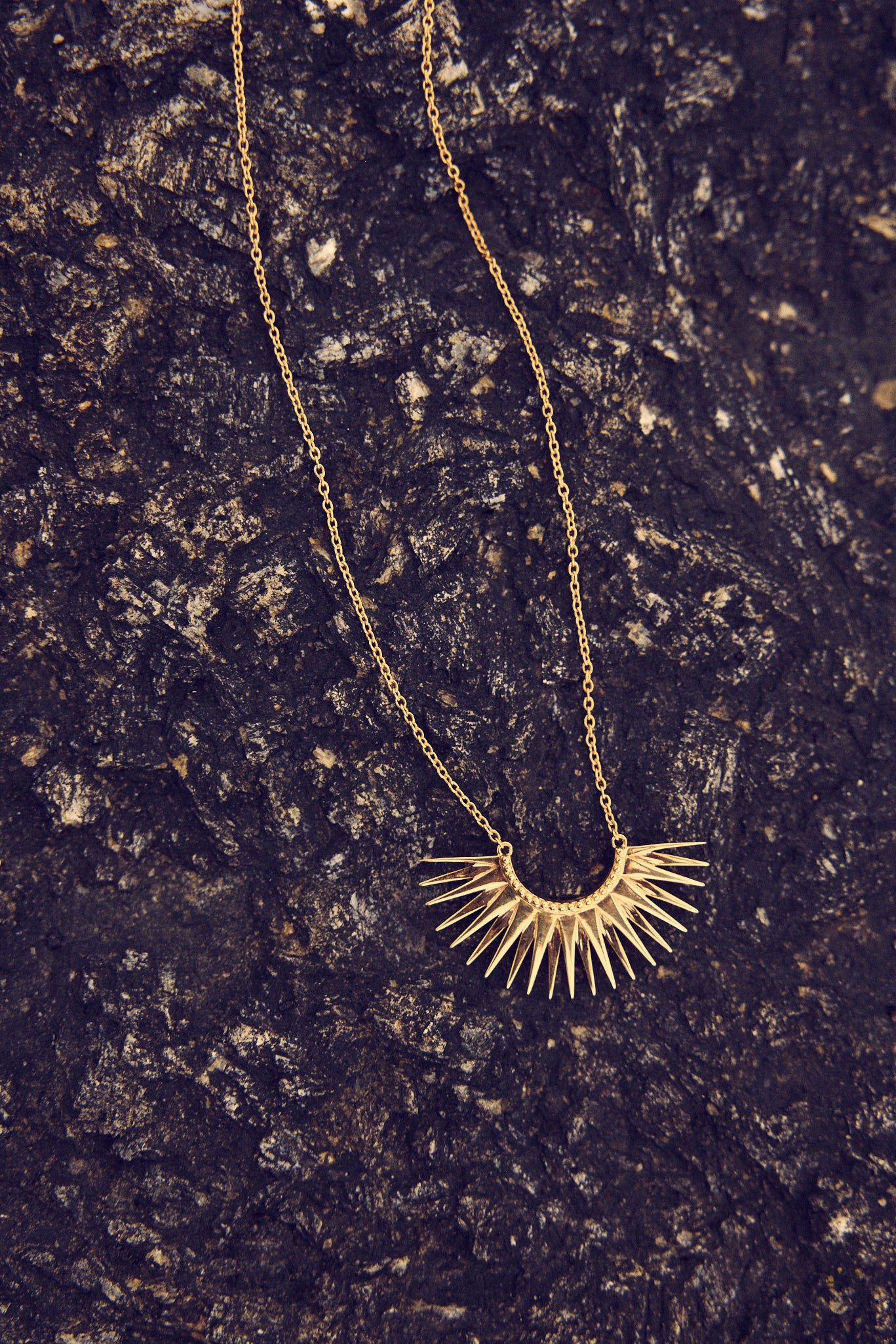 medium sized half sunshine with gold spikes on a delicate gold chain from rachel jackson 