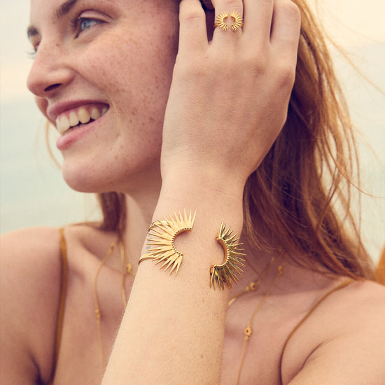 gold half sunshine ring with spikes from rachel jackson model shot