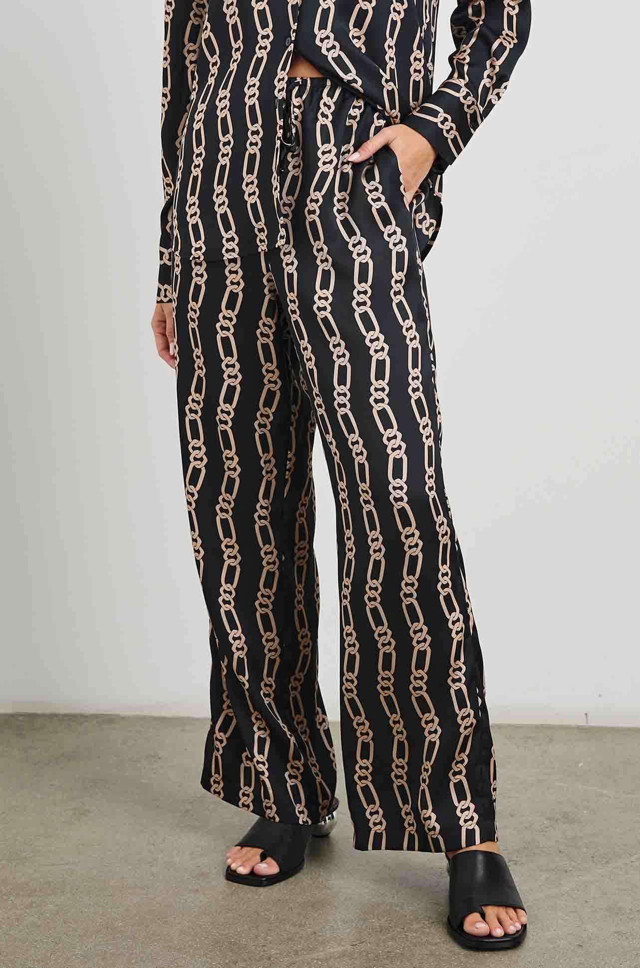 silky black wide leg drawstring trousers with gold link pattern