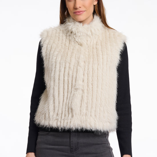 light beige faux fur sleeveless gilet with high neck, central closure and stripe detailing