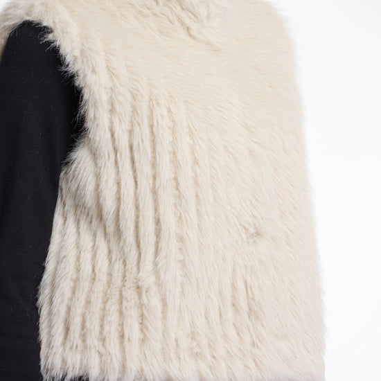 light beige faux fur sleeveless gilet with high neck, central closure and stripe detailing side view 