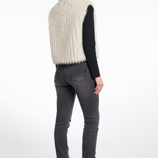 light beige faux fur sleeveless gilet with high neck, central closure and stripe detailing rear view 