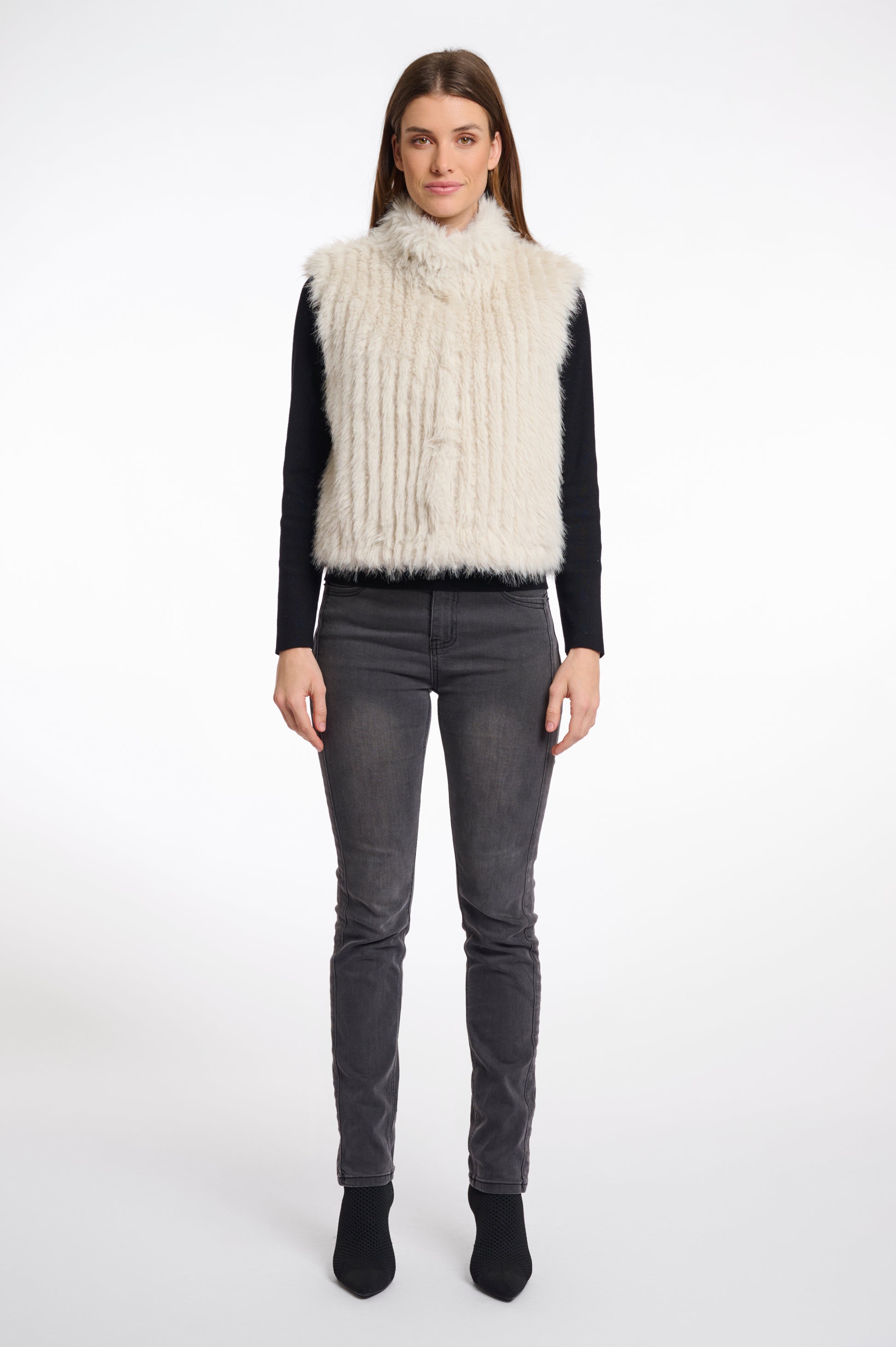 light beige faux fur sleeveless gilet with high neck, central closure and stripe detailing model shot