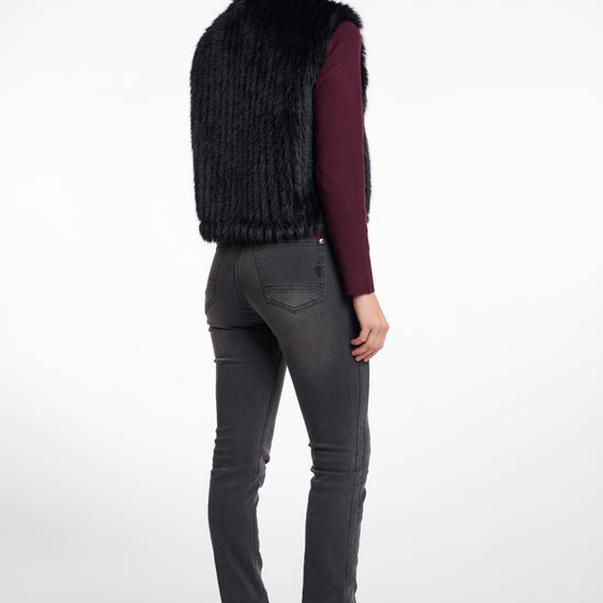 black faux fur sleeveless gilet with high neck, central closure and stripe detailing rear view 