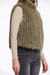 dark green faux fur gilet with high round neck and stripe detailing with central closure  side view