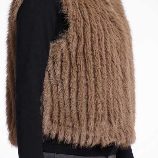 brown faux fur gilet with high round neck and stripe detailing with central closure side view