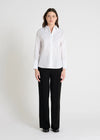 white classic shirt with concealed placket, curved hem and stitch detailing model shot