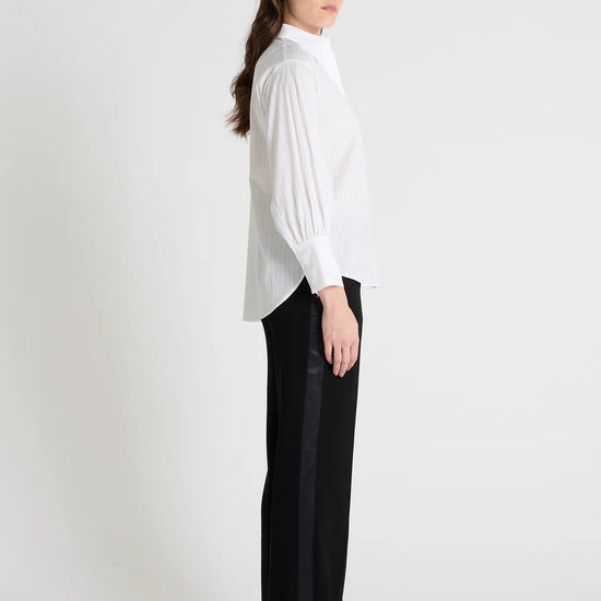 white classic shirt with concealed placket, curved hem and stitch detailing side view
