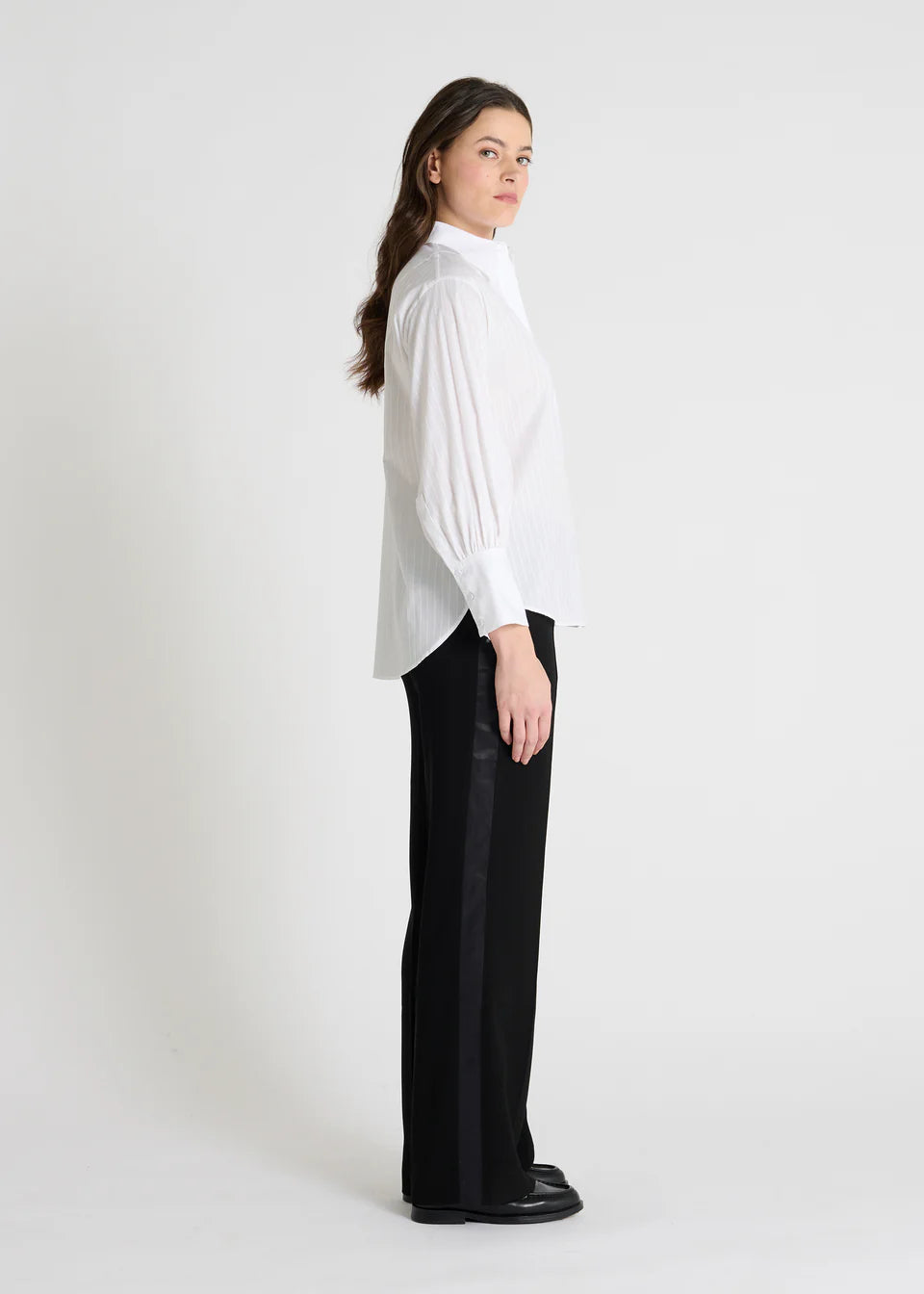 white classic shirt with concealed placket, curved hem and stitch detailing side view