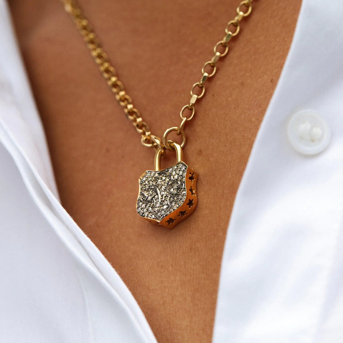 Gold and diamond chunky lock necklace on gold belcher chain