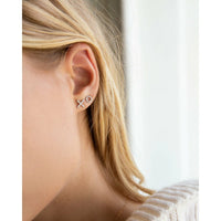 X and O stud earrings in silver with pave diamonds