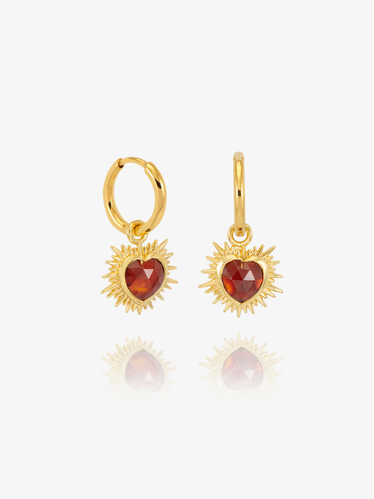 gold spiky heart shaped charm earrings with red stone and huggie hoops from rachel jackson