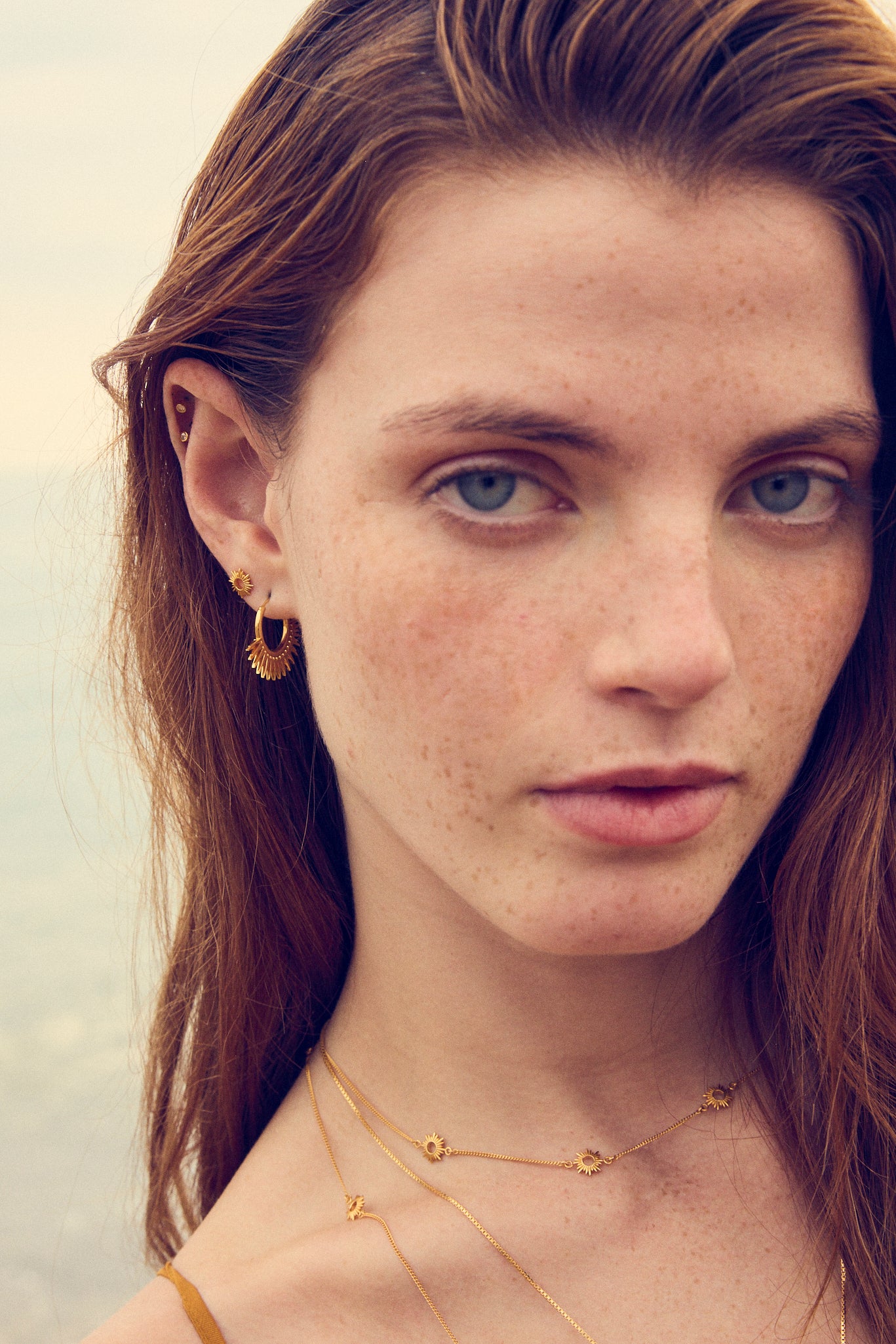 sunshine stud gold earring with butterfly fastening from rachel jackson model shot