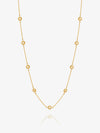 Gold necklace with sUN-shaped detail on a white background