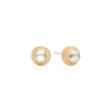 Pair of gold and pearl stud earrings on a white background from Anna Beck