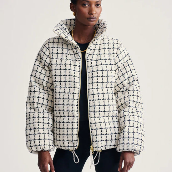 mono check short puffer with high neck and side pockets model shot