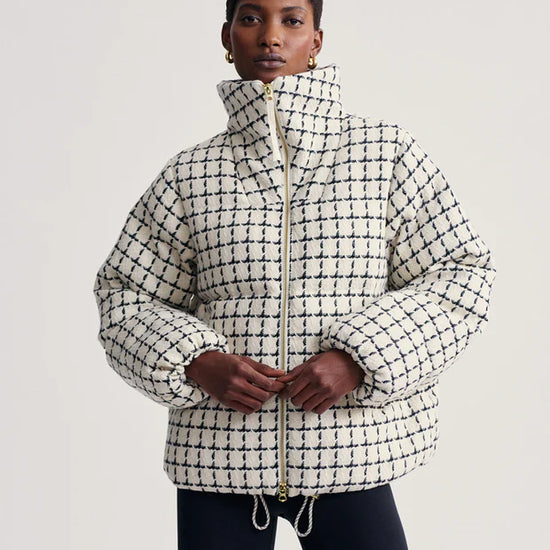 mono check short puffer with high neck and side pockets model shot