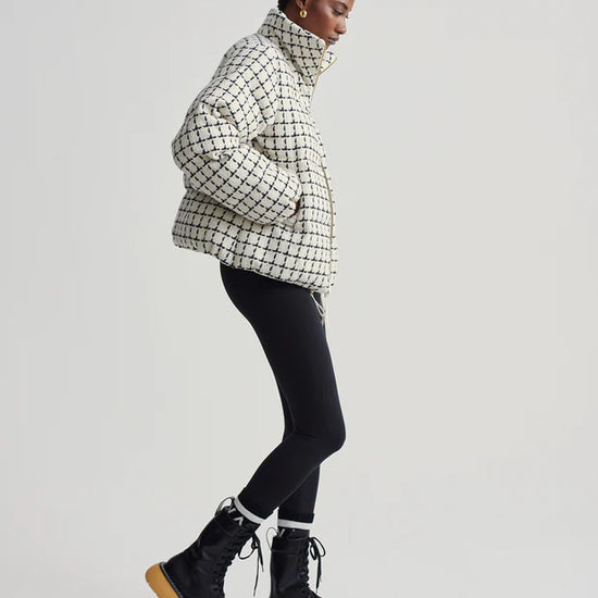 mono check short puffer with high neck and side pockets  side view 