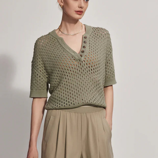 Short sleeve pointelle knit with a notch neck and button detail