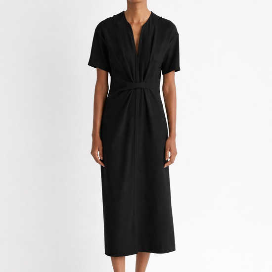 Woman wearing a black dress on a white background from Mei mei J