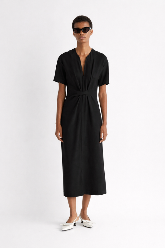 Woman wearing a black dress on a white background from Mei mei J